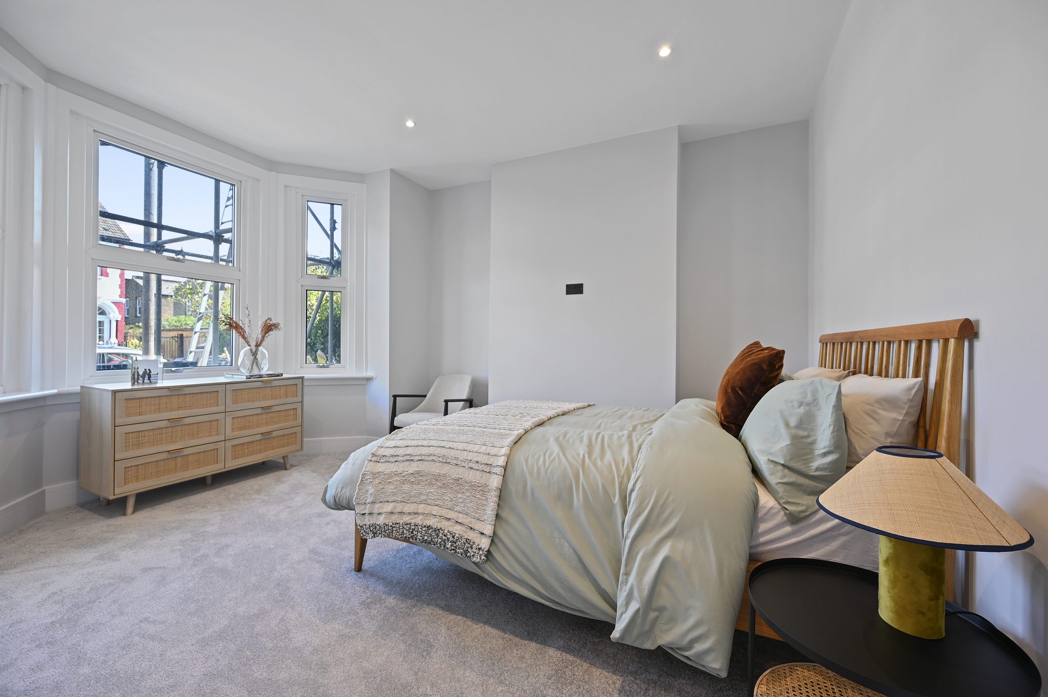 Open-plan reception and kitchen of the refurbished flat at Larden Road, Acton W3