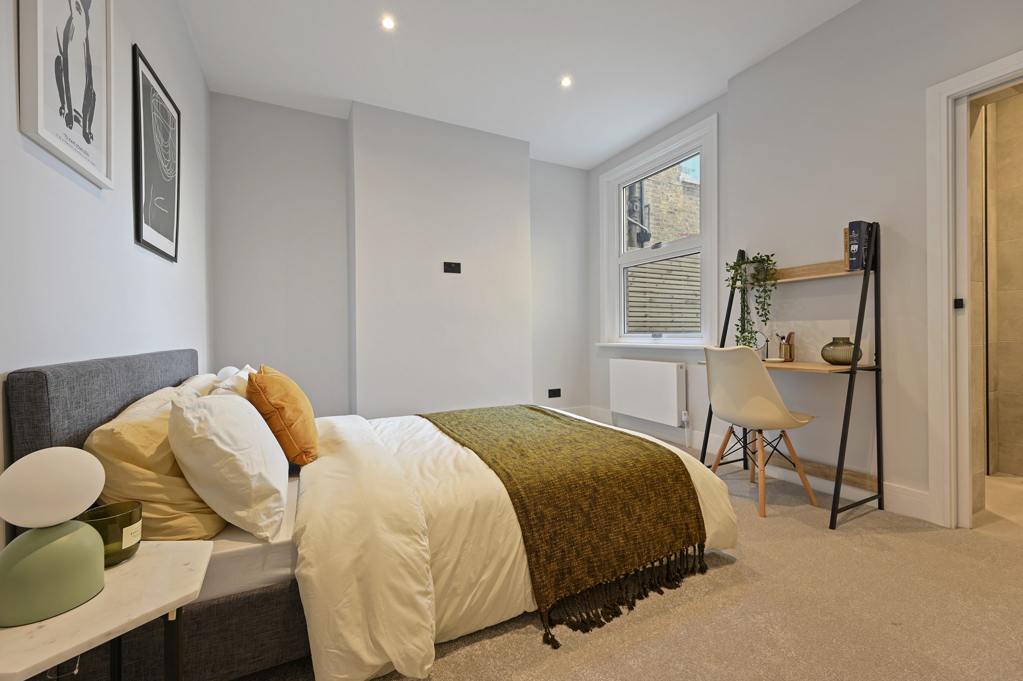 Open-plan reception and kitchen of the refurbished flat at Larden Road, Acton W3