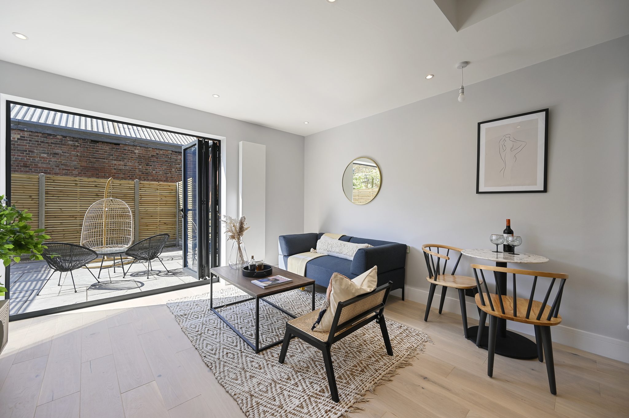 Open-plan reception and kitchen of the refurbished flat at Larden Road, Acton W3