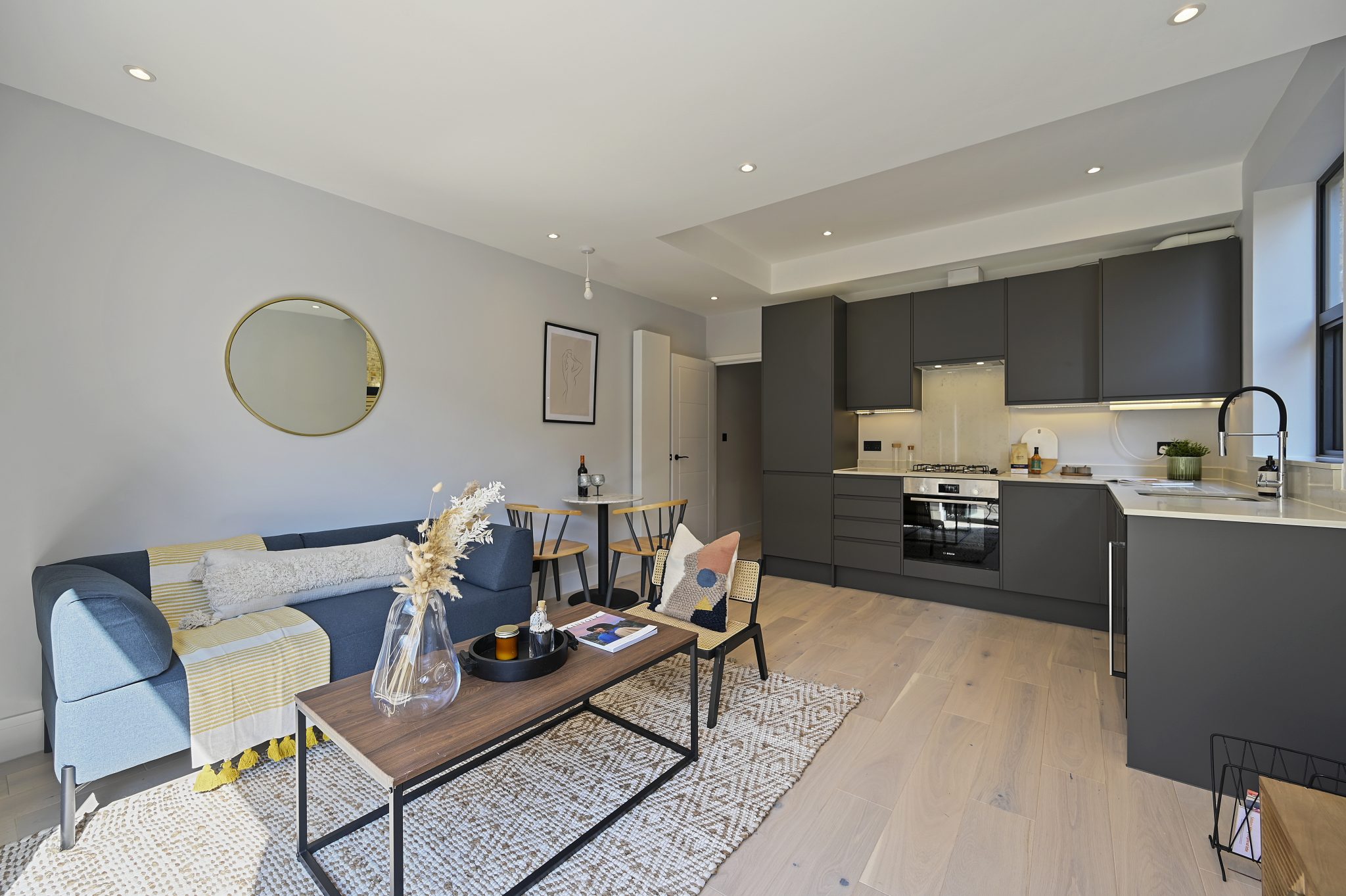Open-plan reception and kitchen of the refurbished flat at Larden Road, Acton W3