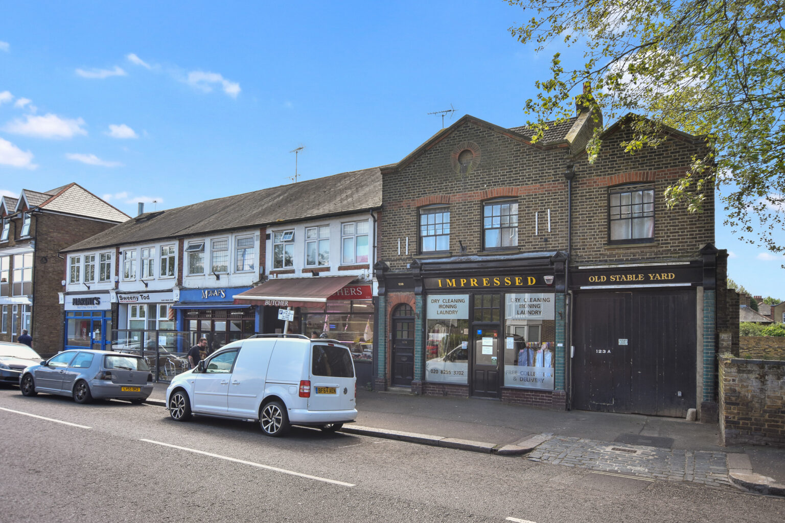 Exterior of the Station Road scheme in Hampton, a mixed-use building converted into five flats and a commercial unit