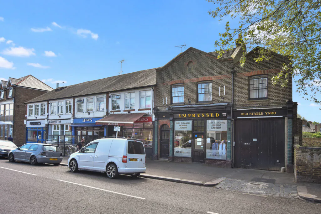 Exterior of the Station Road scheme in Hampton, a mixed-use building converted into five flats and a commercial unit